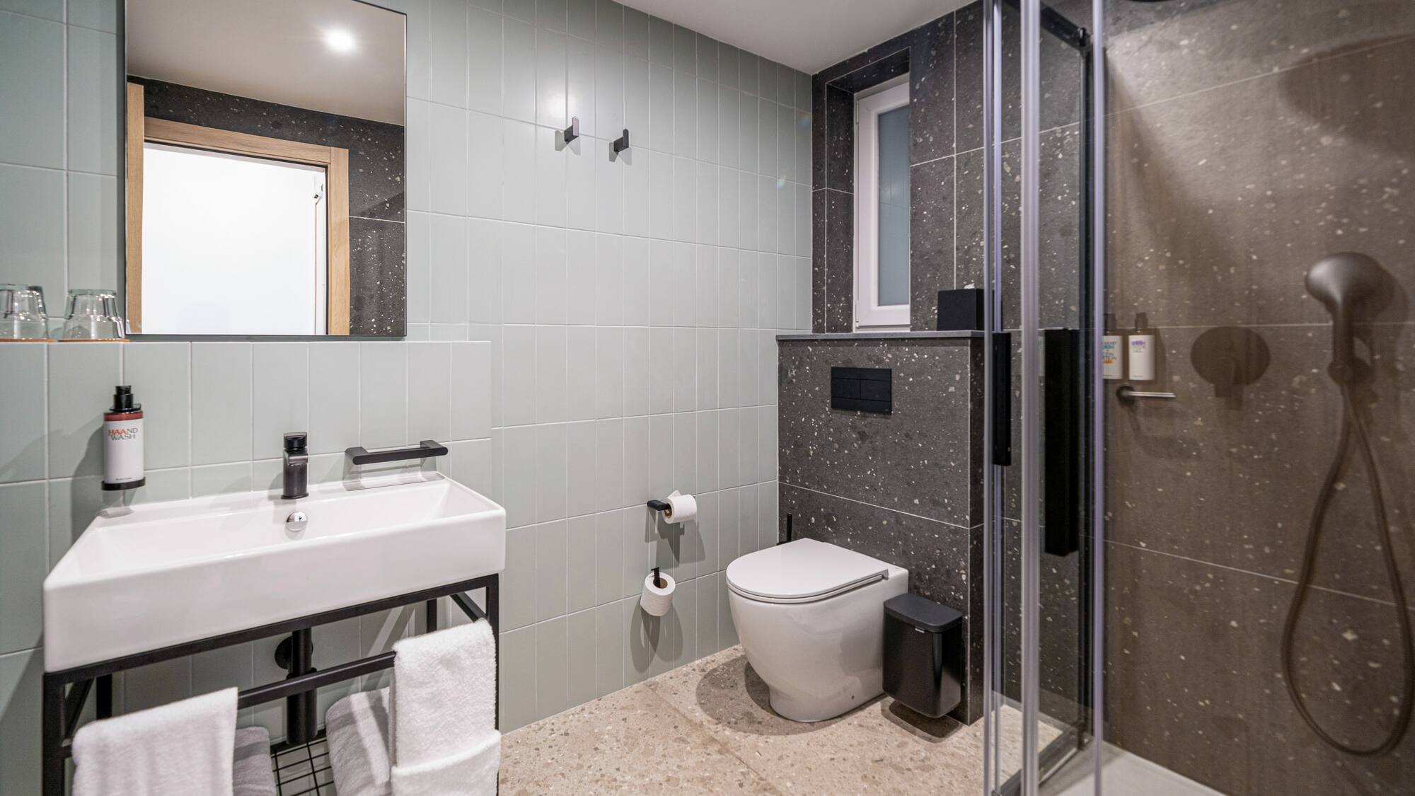a bathroom with a shower and toilet