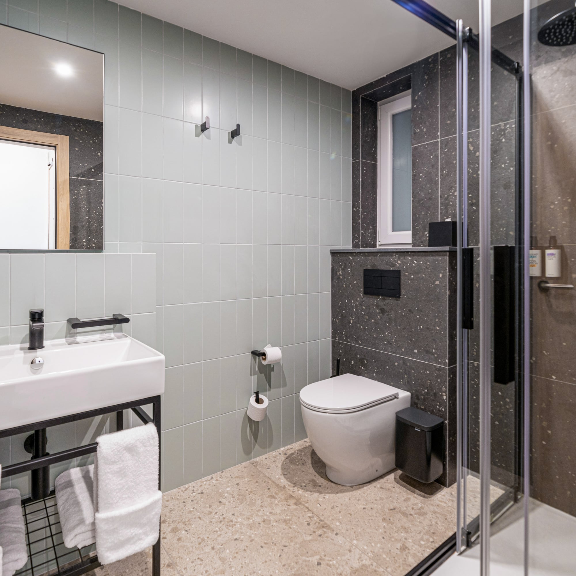 a bathroom with a shower and toilet
