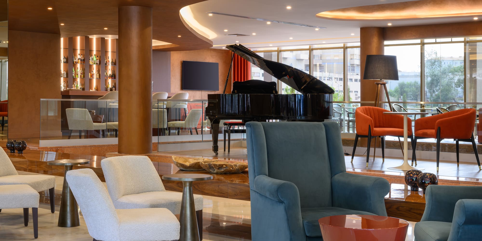 a room with a piano and chairs