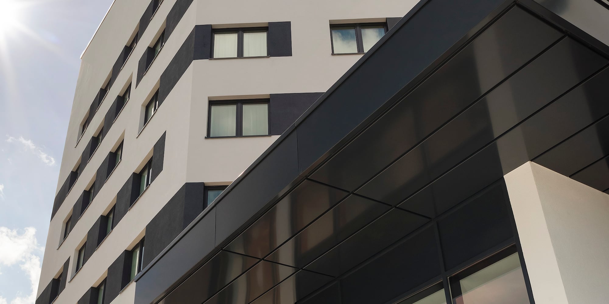 a building with a tree in front of it