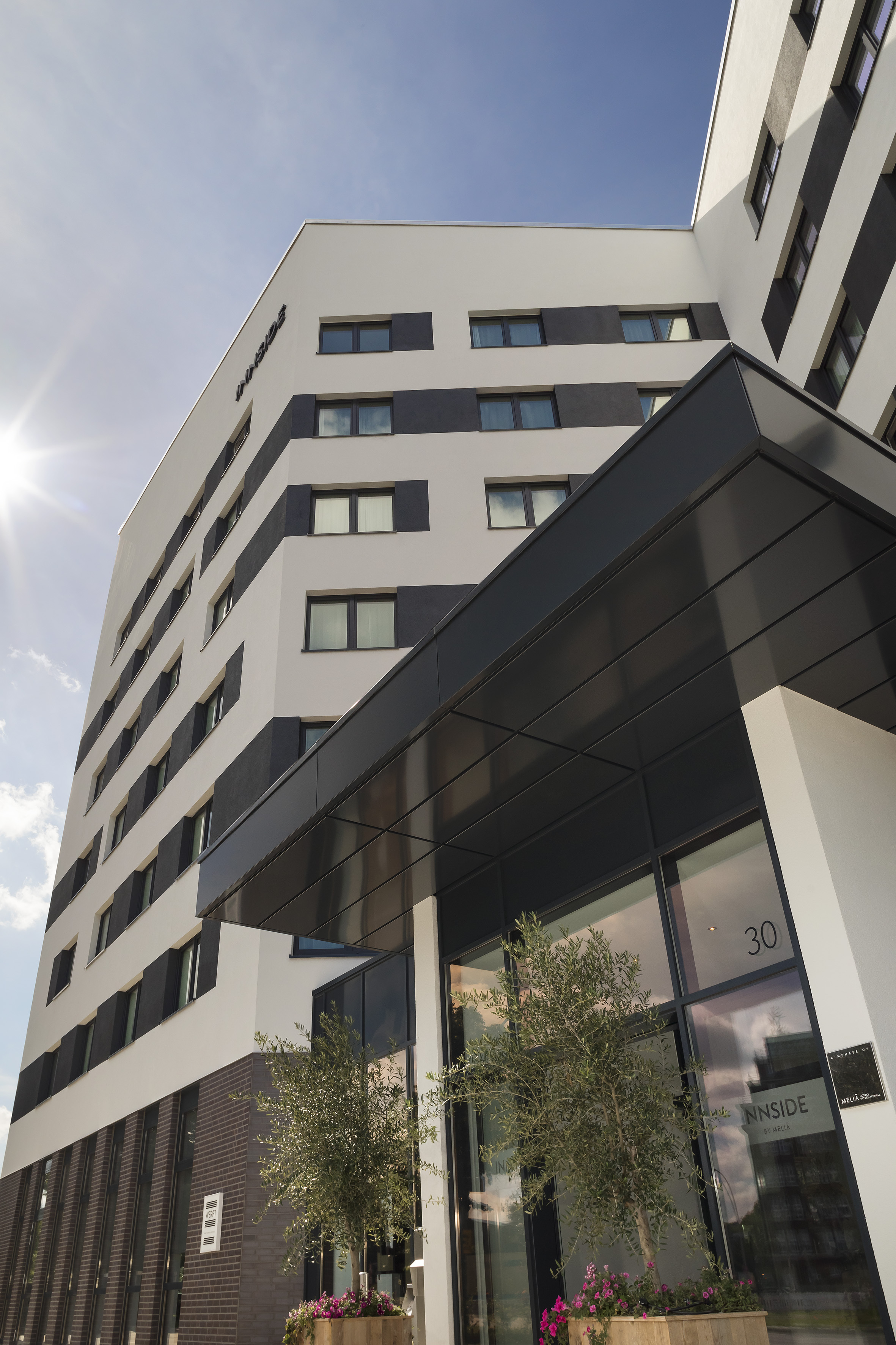 a building with a tree in front of it