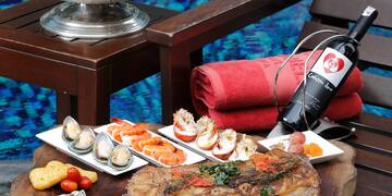 a table with food and wine bottles