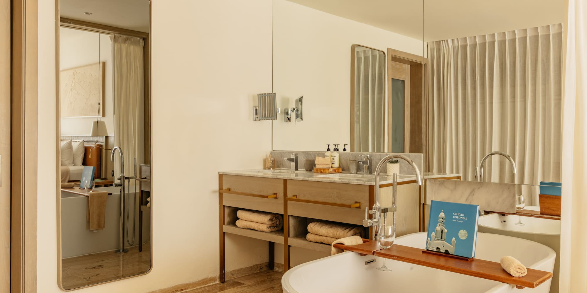 Luxury bathroom with freestanding tub, double vanity, and marble accents.
