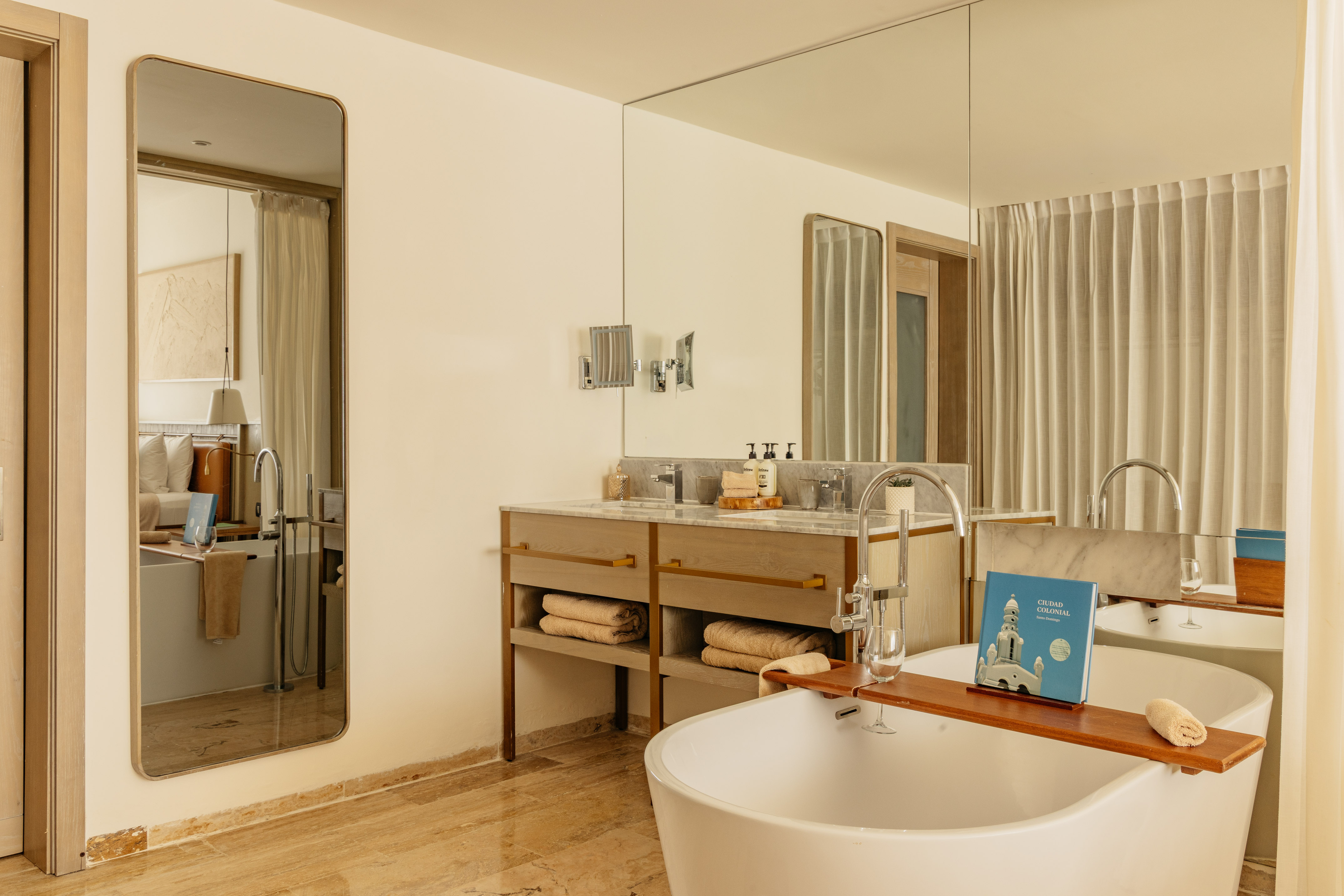 Luxury bathroom with freestanding tub, double vanity, and marble accents.
