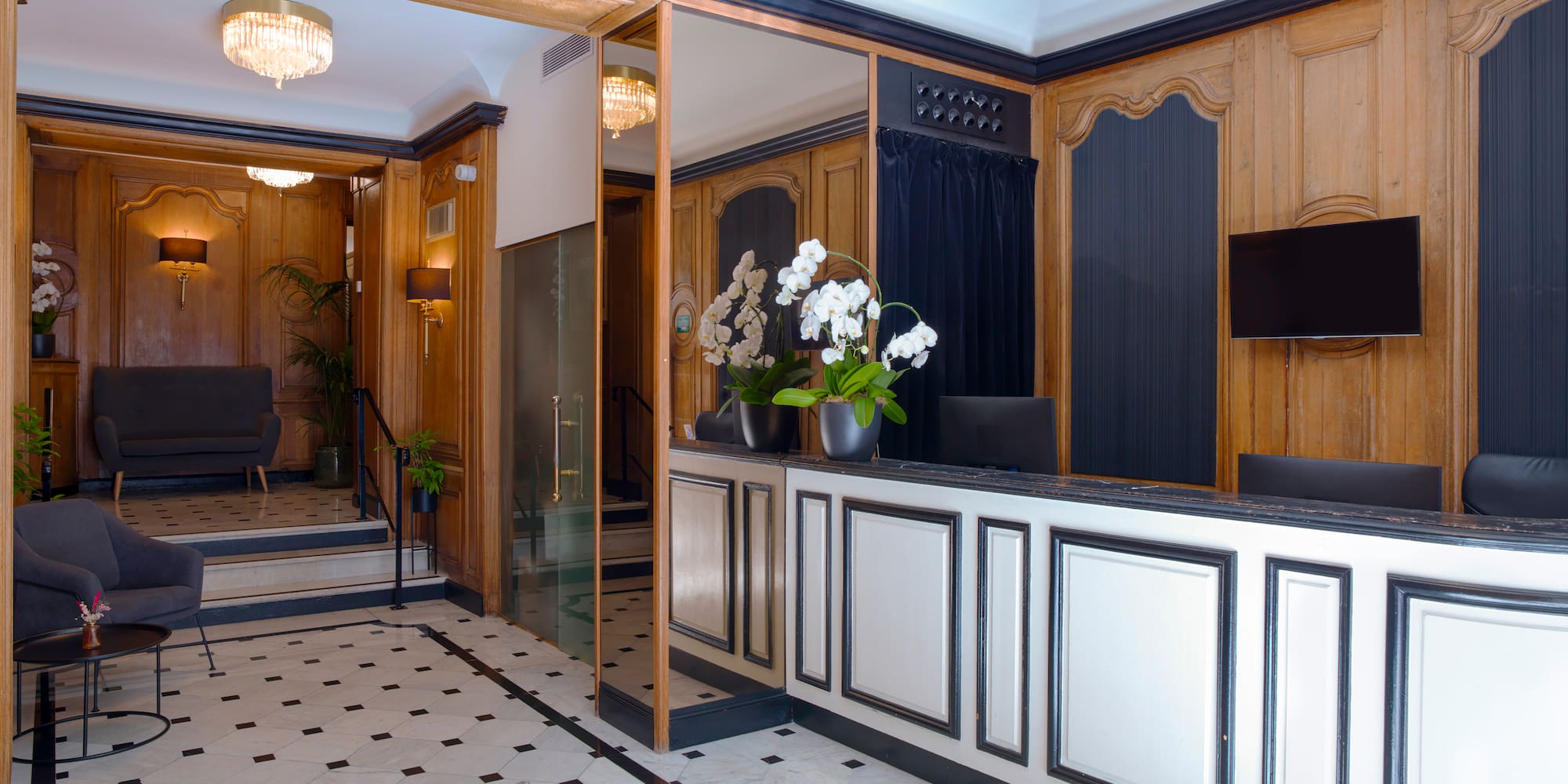 a lobby with a reception desk and chairs