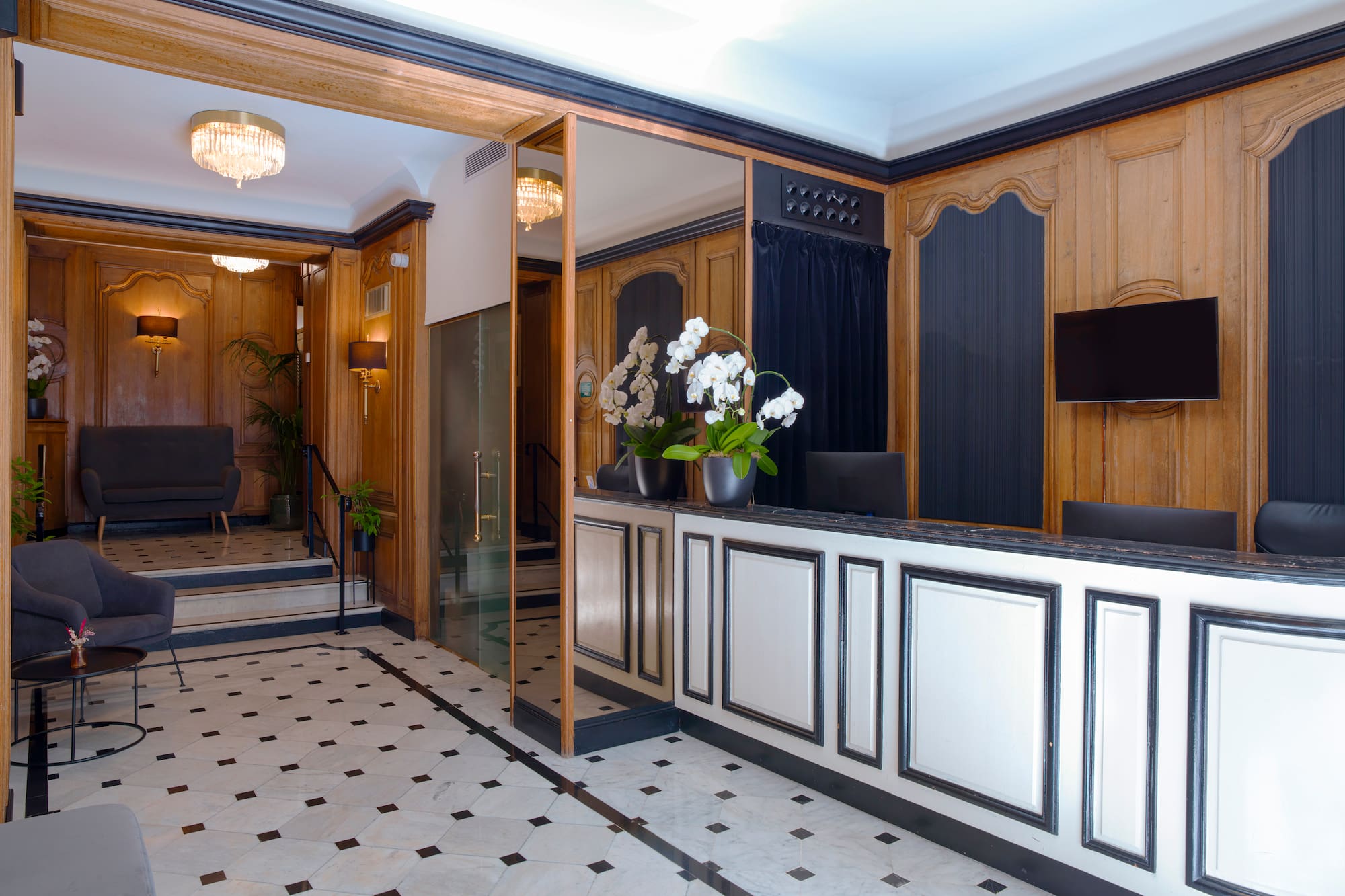 a lobby with a reception desk and chairs