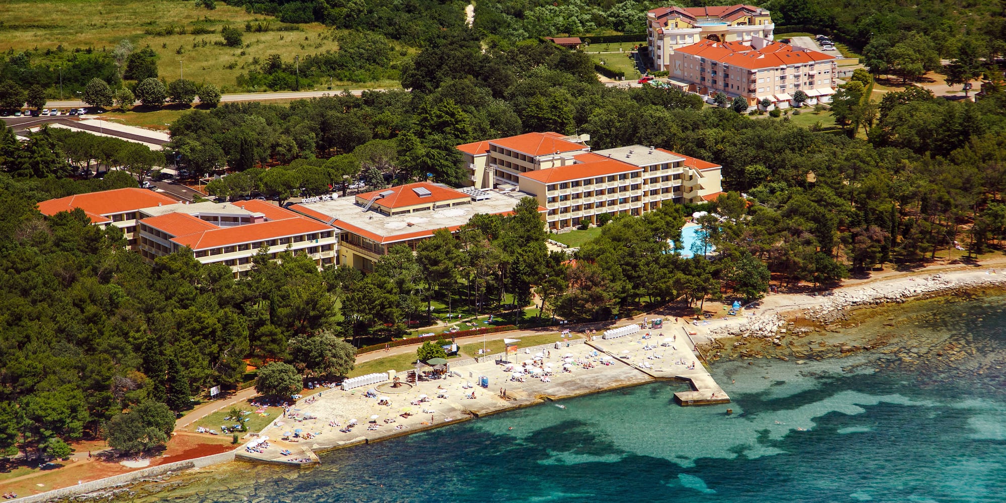 a group of buildings next to a body of water