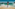 Curly-haired woman in white bikini running in ocean waves on sunny beach.