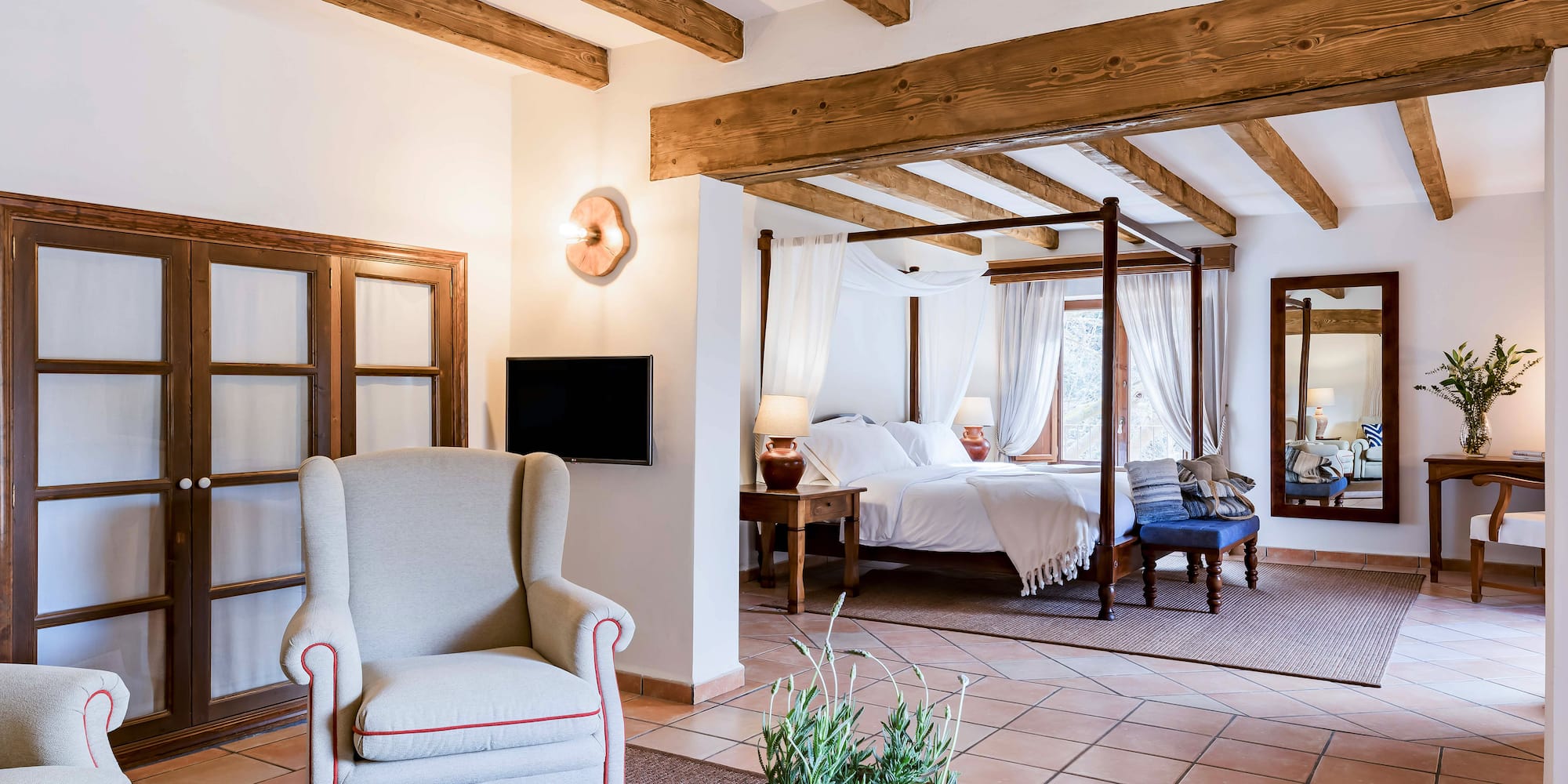 a room with a bed and a chair