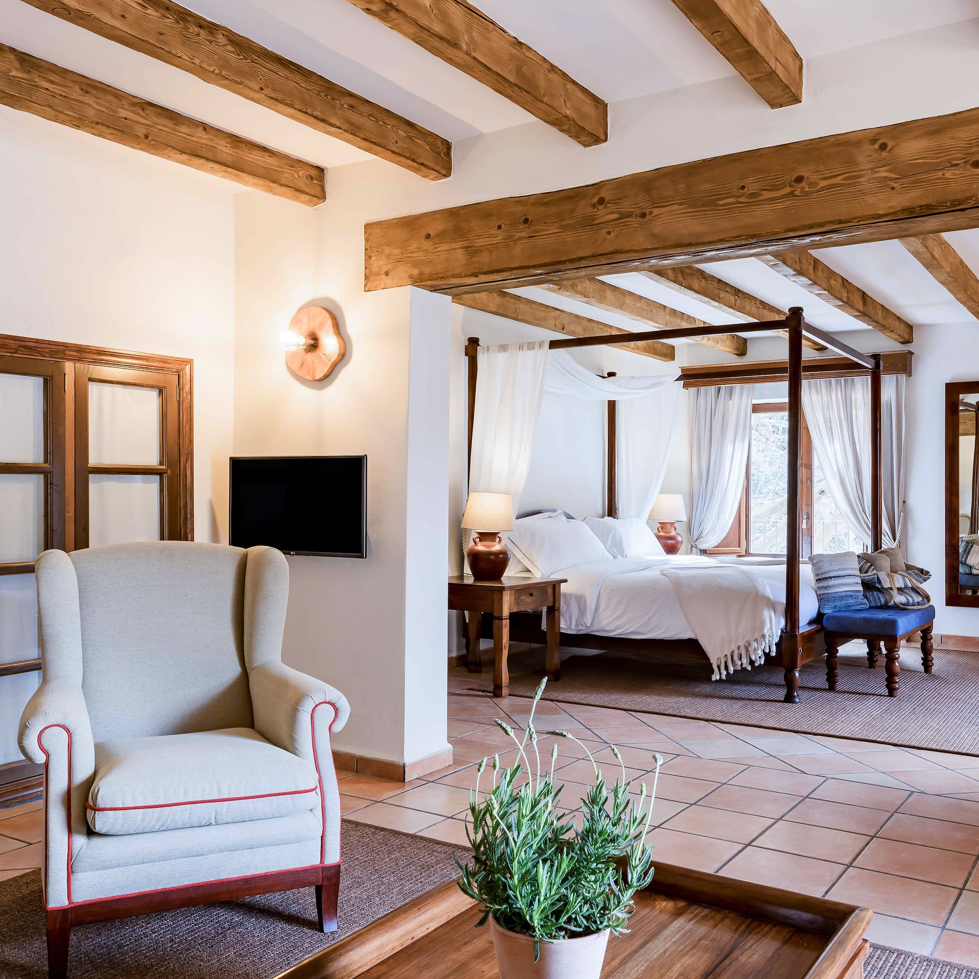 a room with a bed and a chair