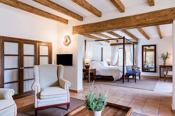 a room with a bed and a chair