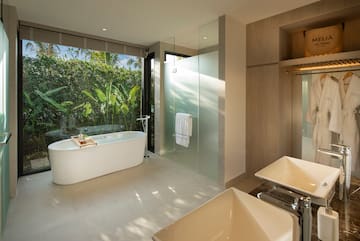 a bathroom with a tub and sink