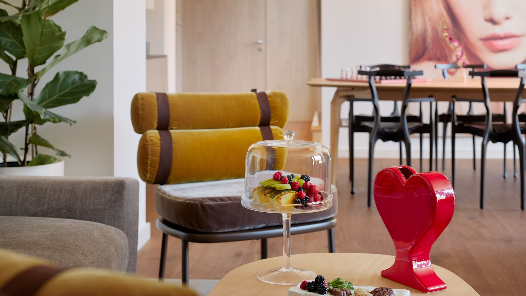 a table with a cake and a red heart on it