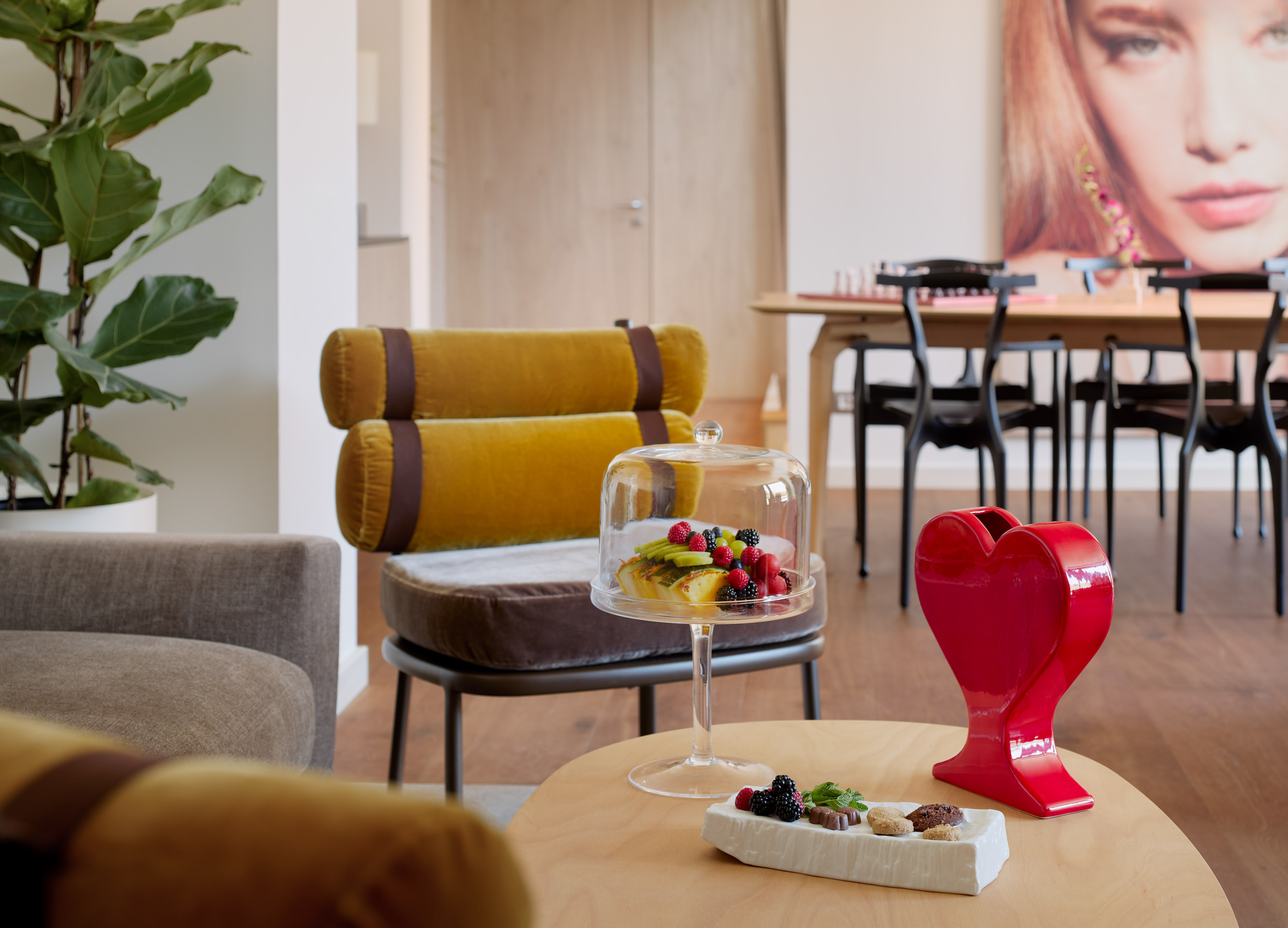 a table with a cake and a red heart on it