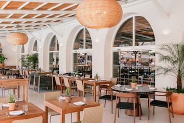 a restaurant with tables and chairs