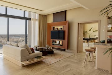 a living room with a tv and a table