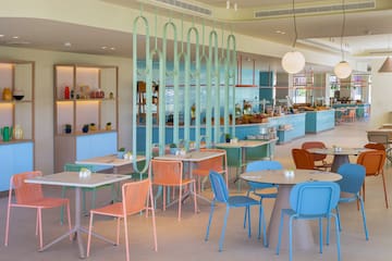 a restaurant with tables and chairs