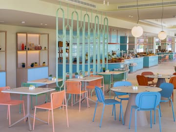 a restaurant with tables and chairs