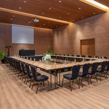 a large conference room with a large screen