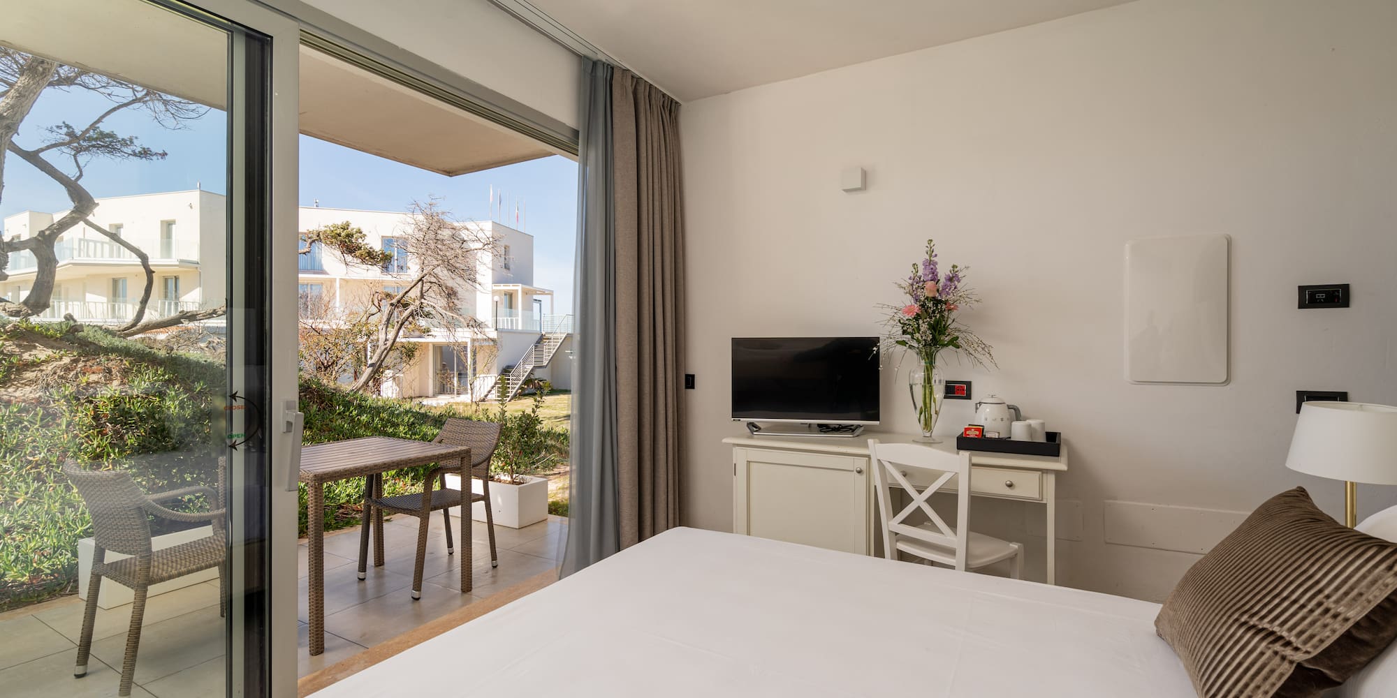 a bedroom with a large glass door