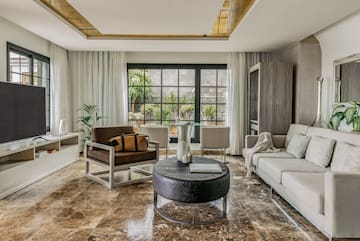 a living room with a couch and chairs