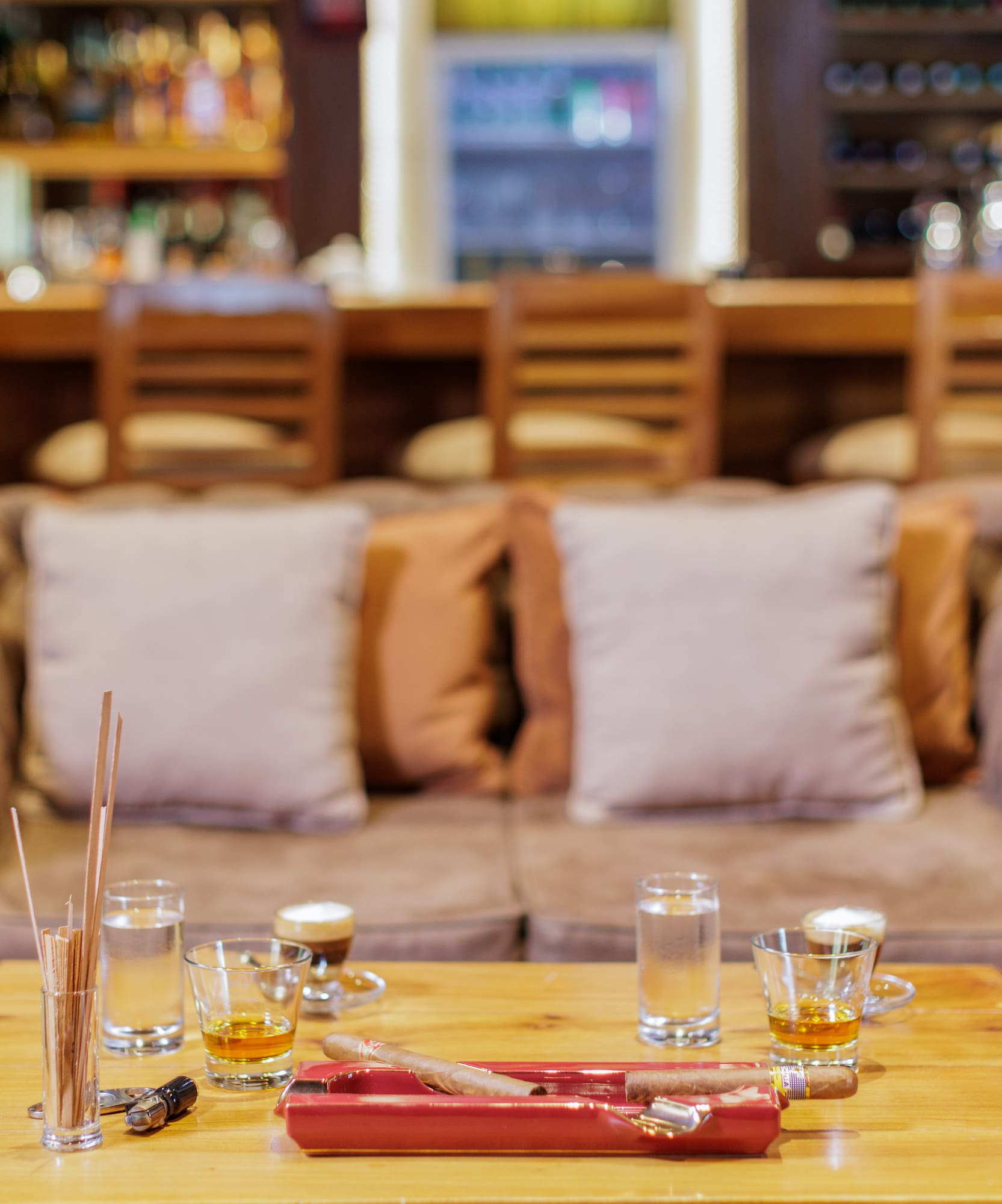 a table with glasses and a tray of liquid on it