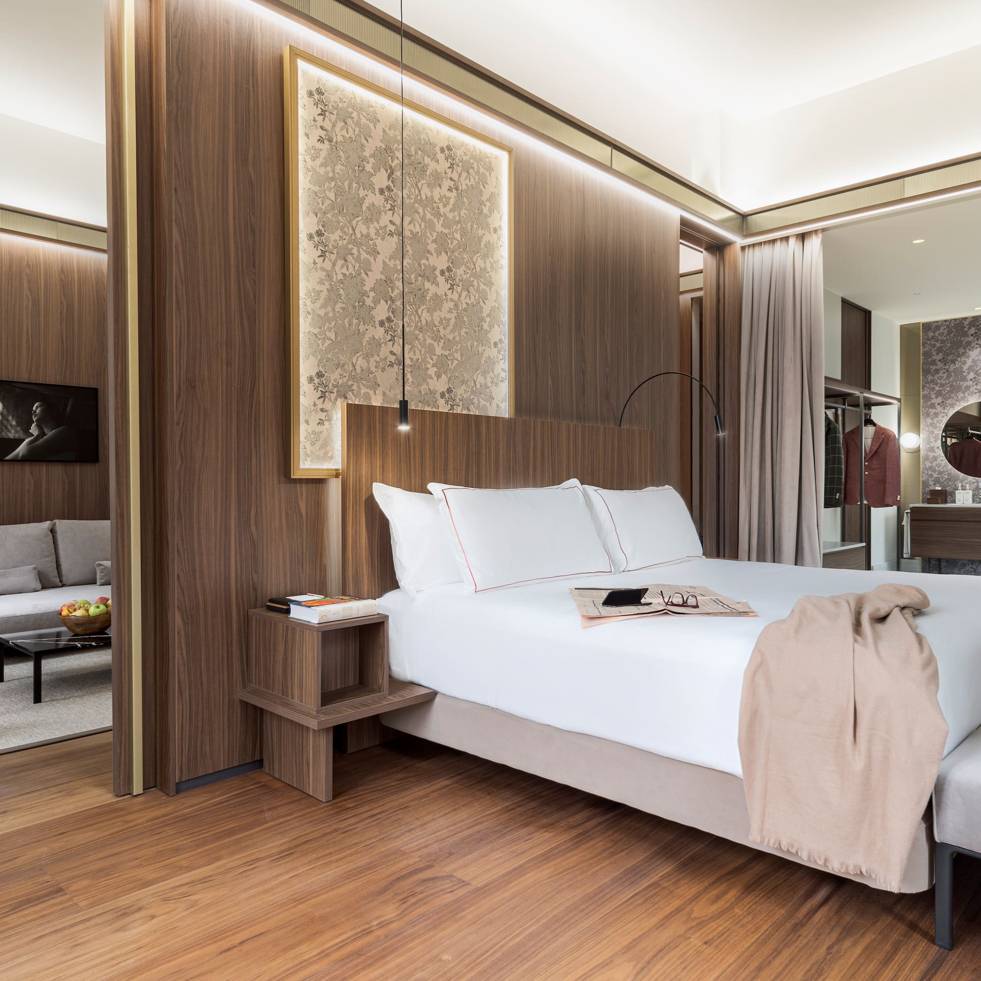 a bedroom with a bed and a mirror