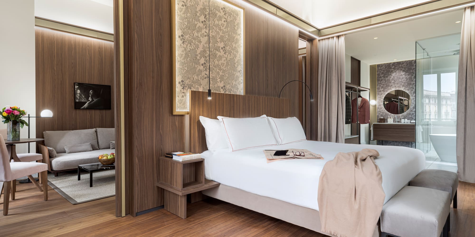 a bedroom with a bed and a mirror