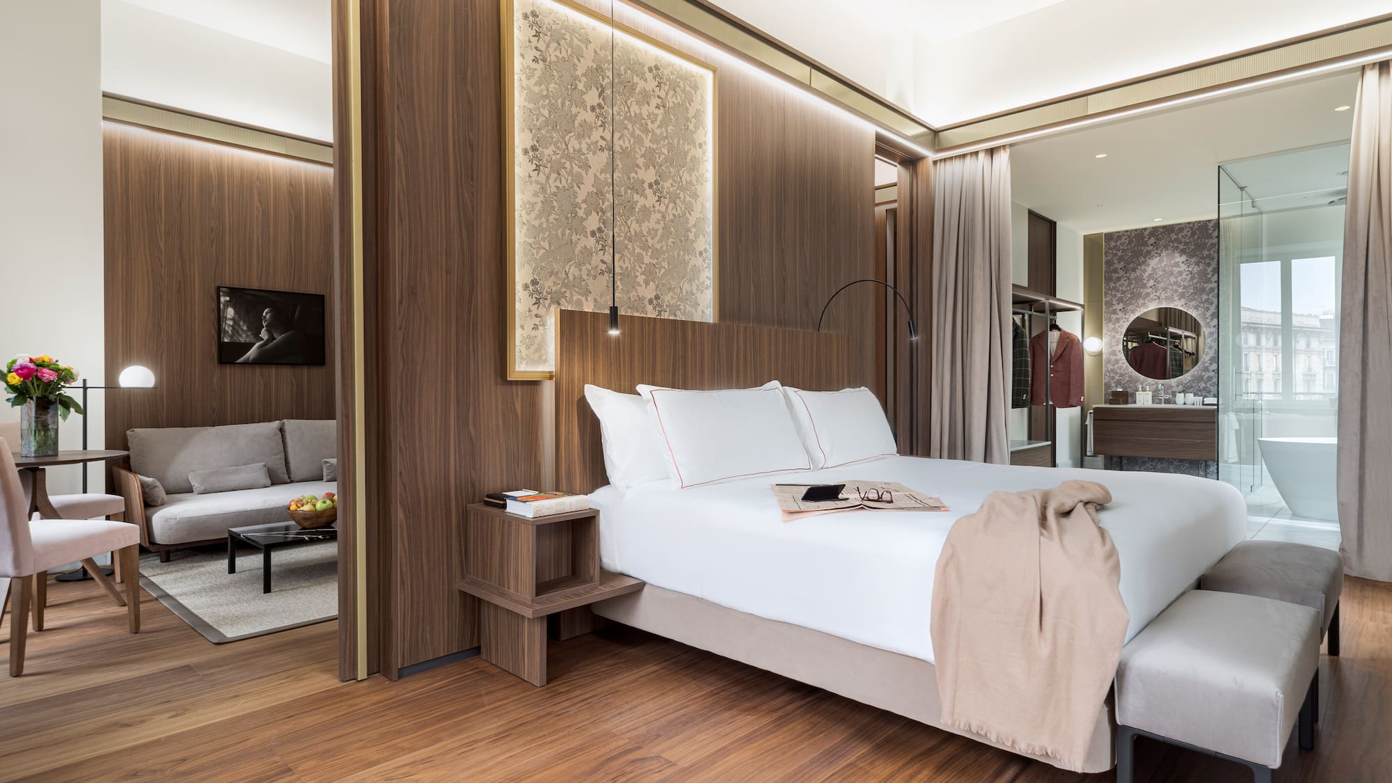 a bedroom with a bed and a mirror