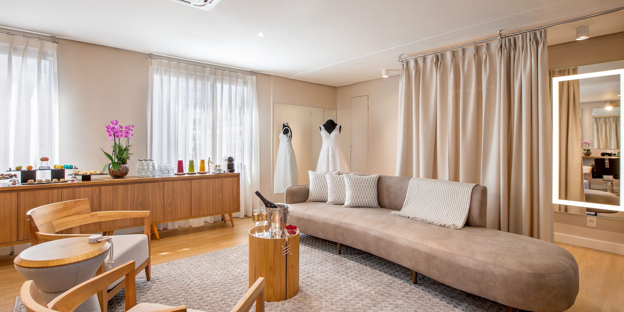 a room with a couch and a table and chairs