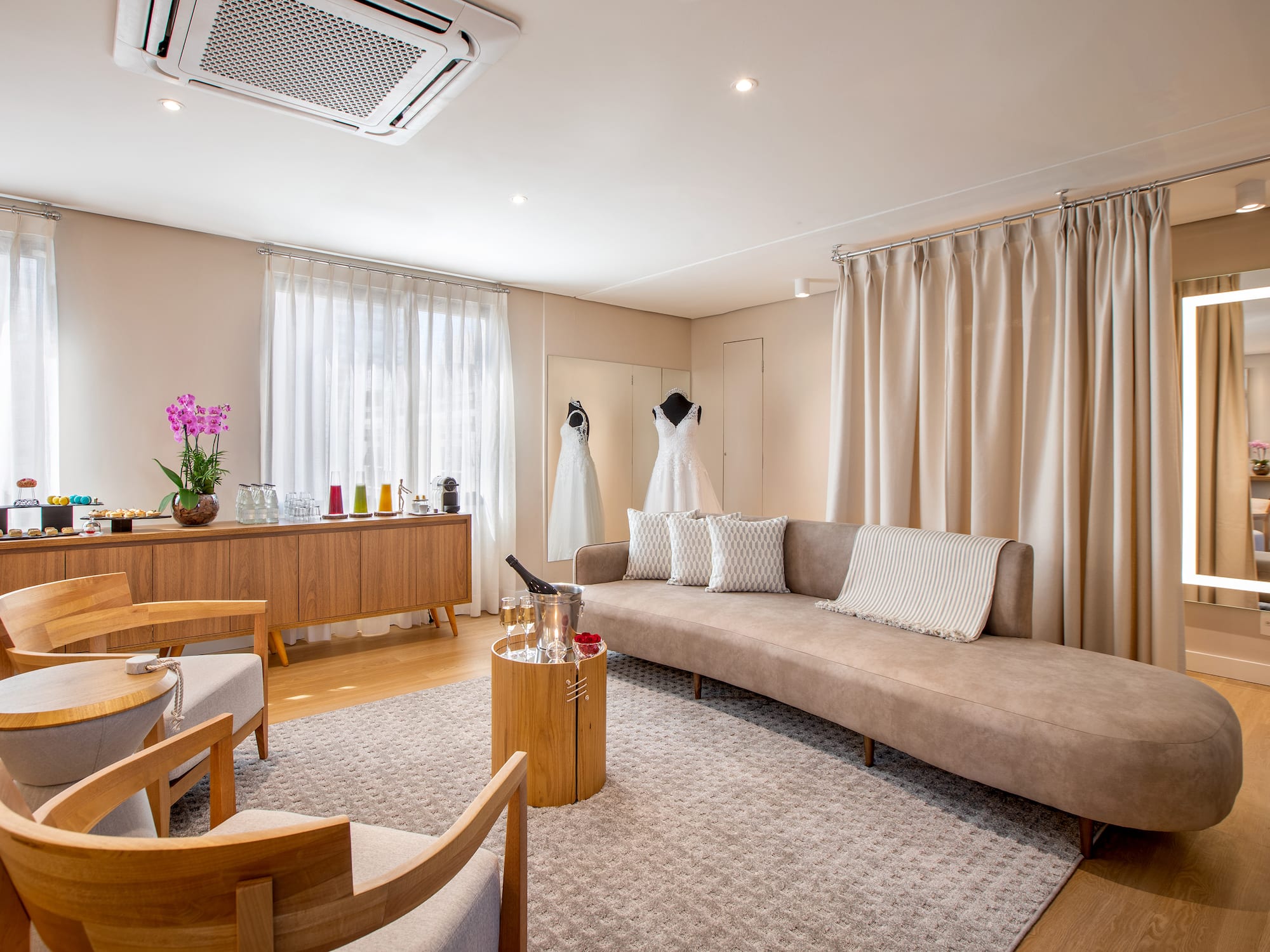 a room with a couch and a table and chairs