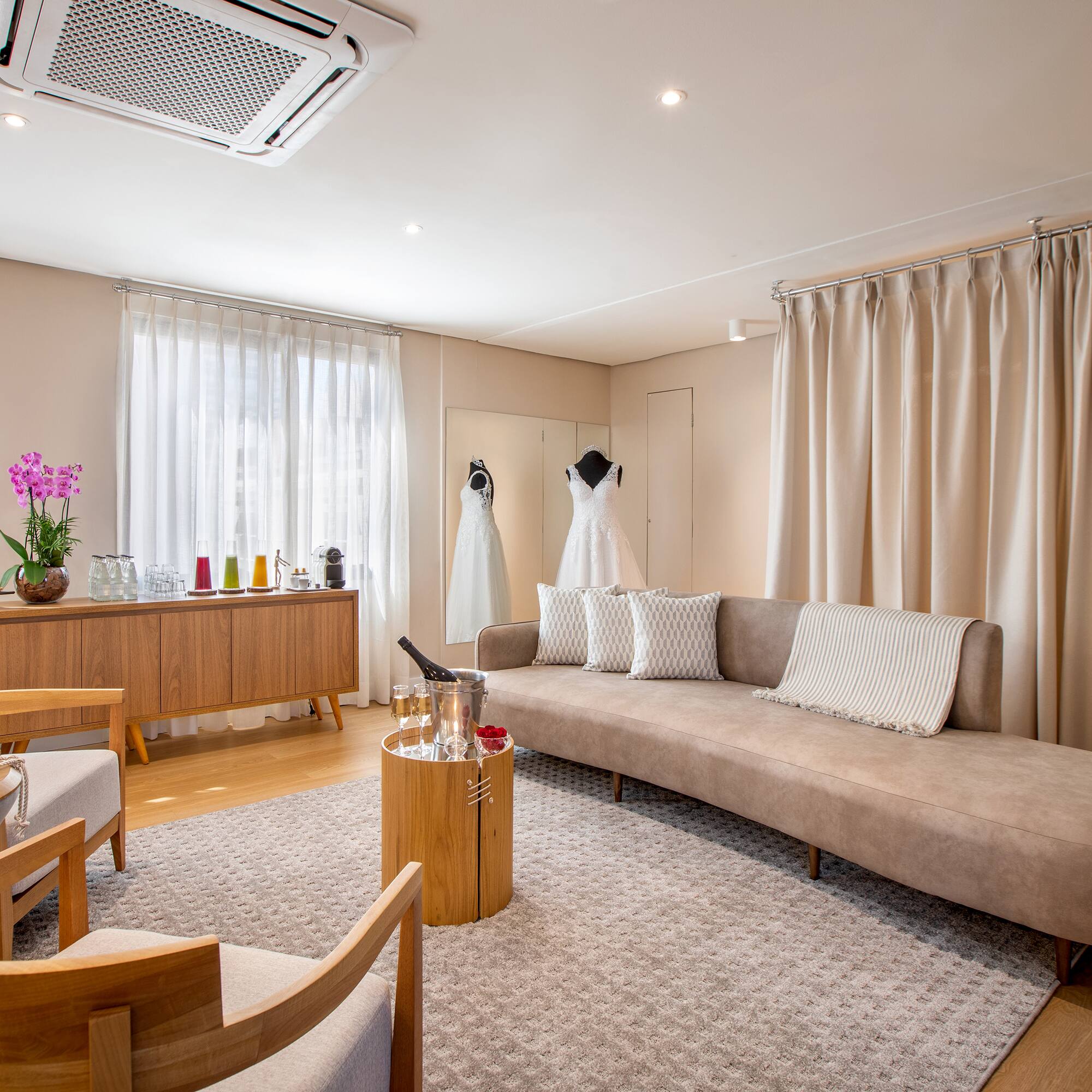 a room with a couch and a table and chairs