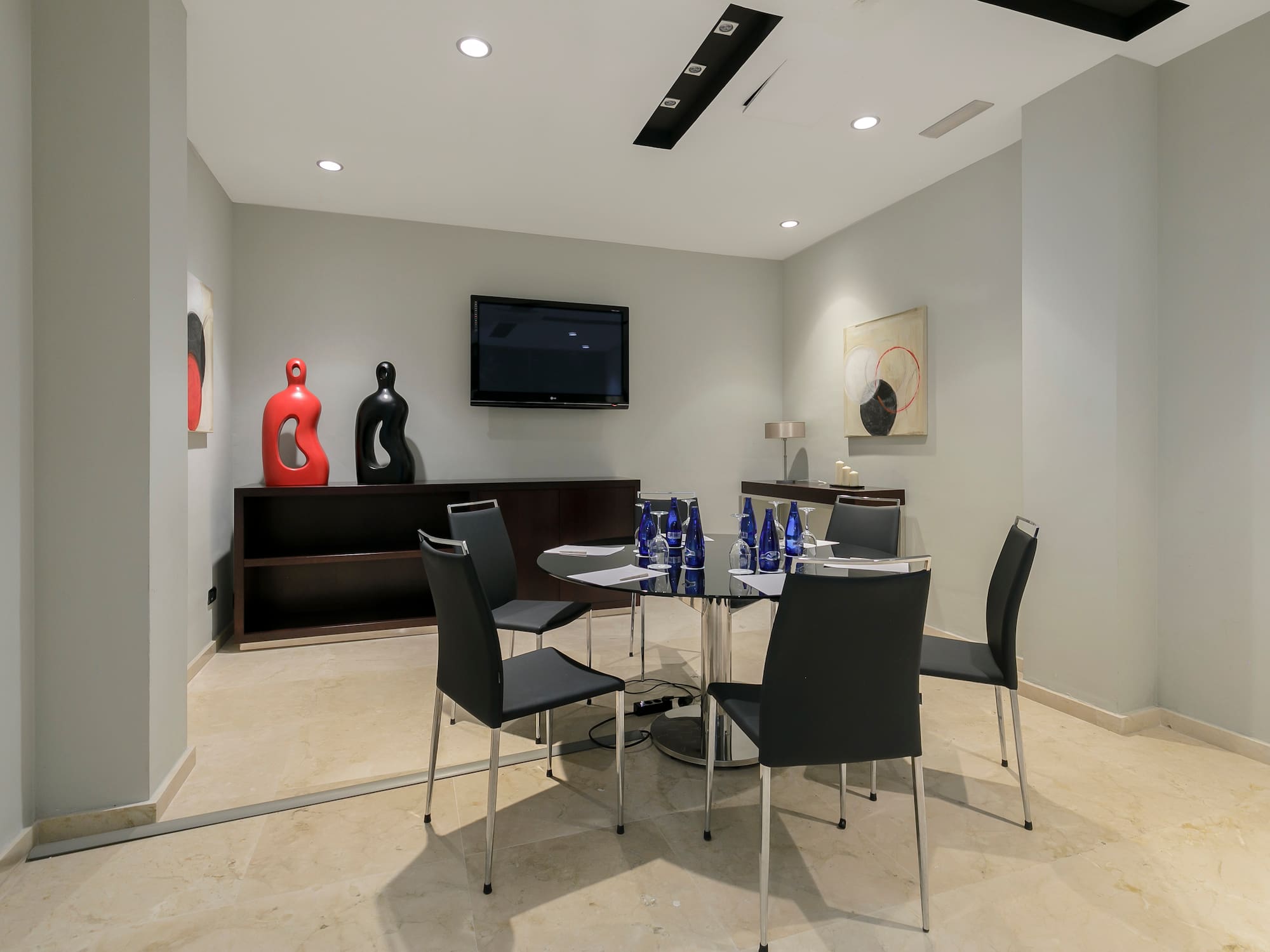 a room with a table and chairs