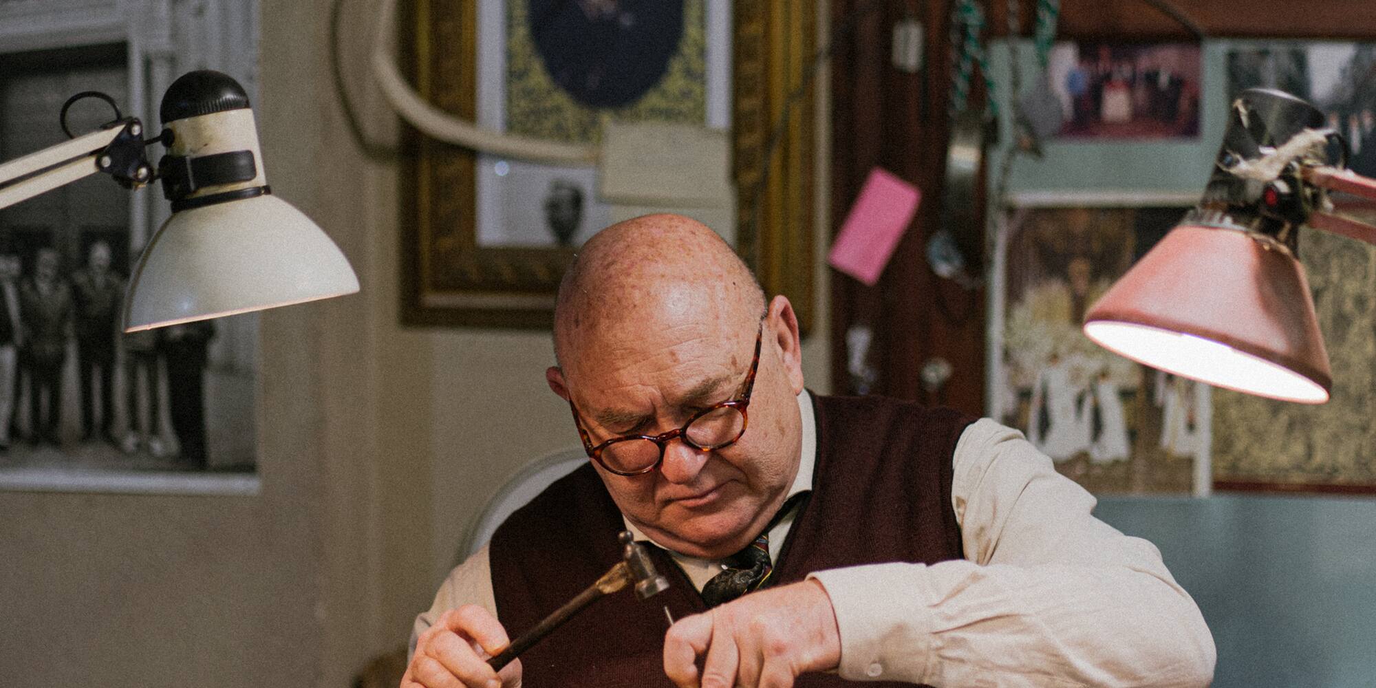 a man working on a piece of wood