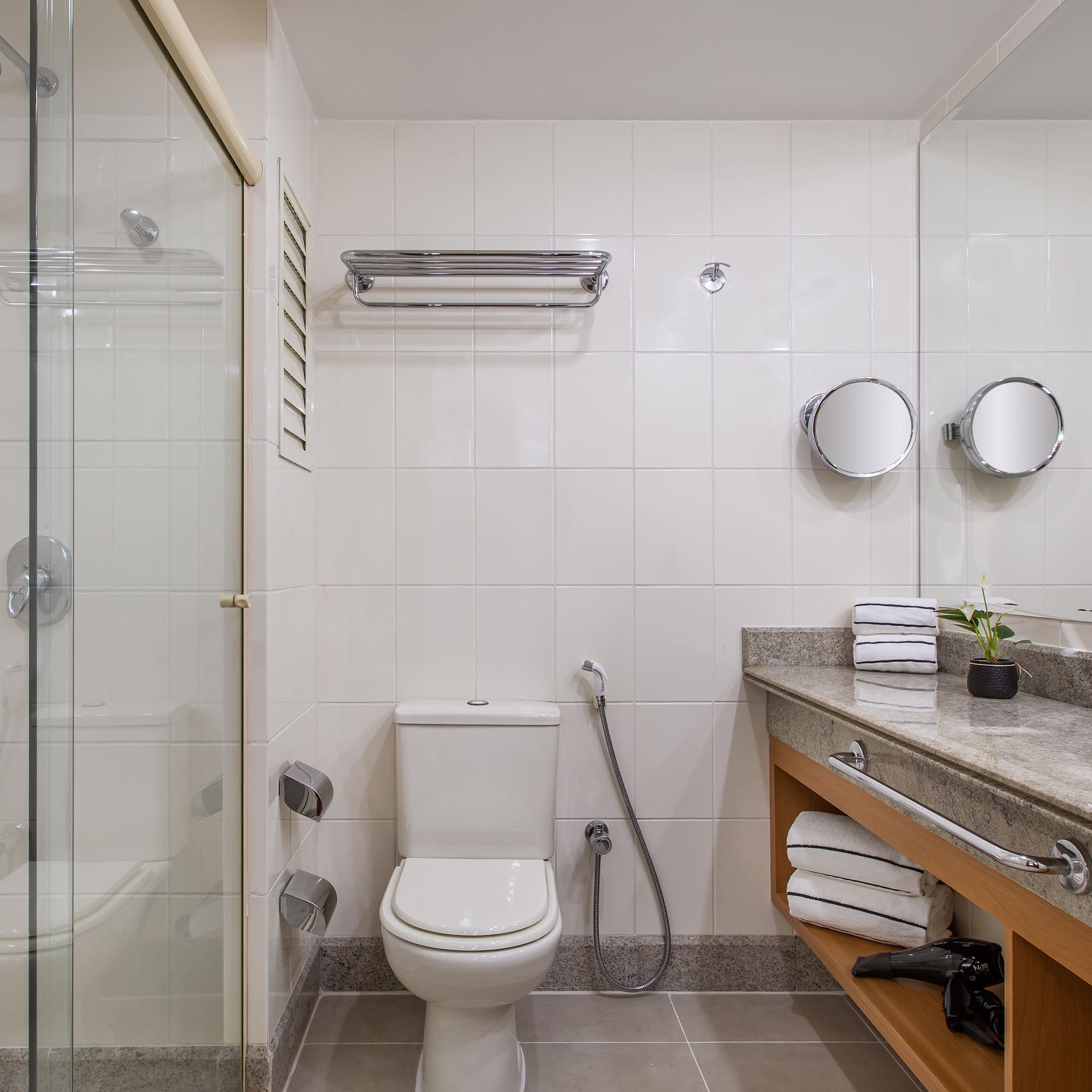 a bathroom with a shower and toilet