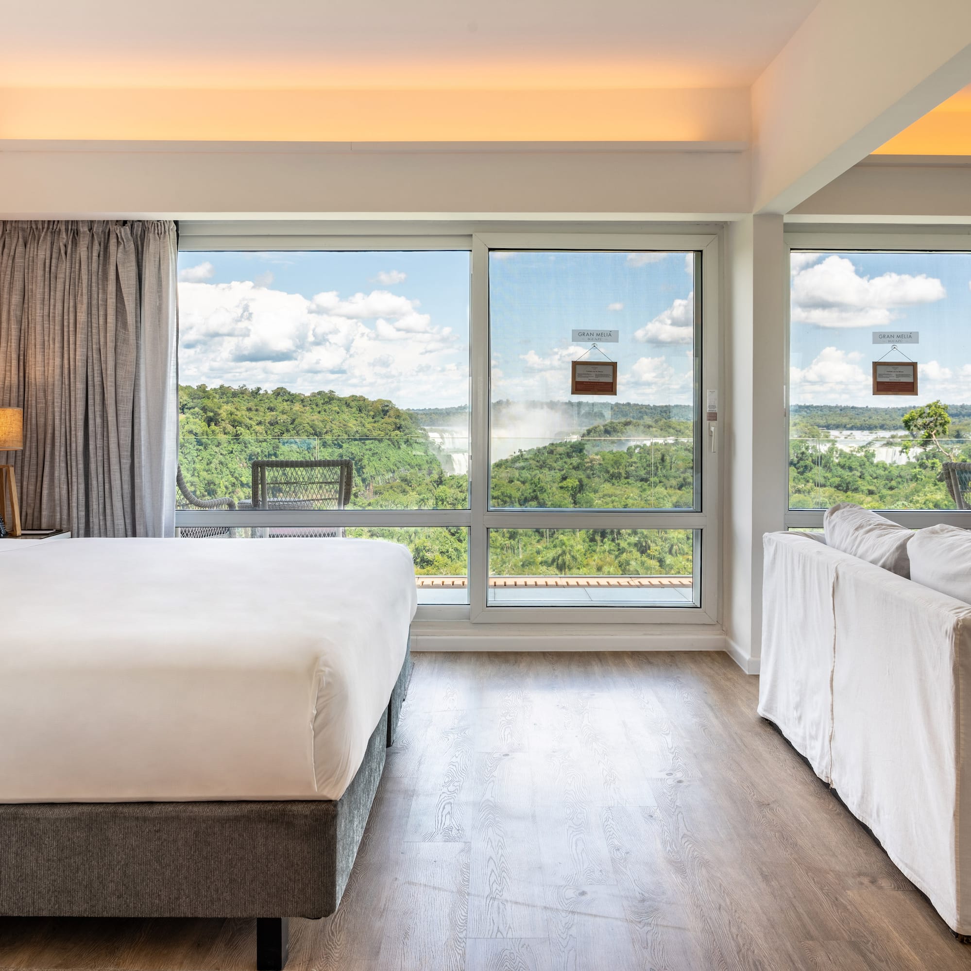 a room with a bed and couches