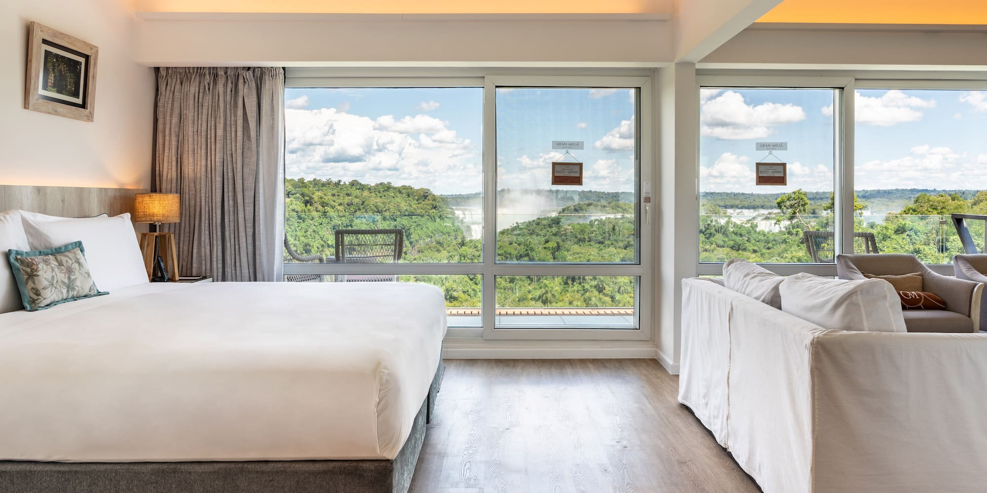 a room with a bed and couches