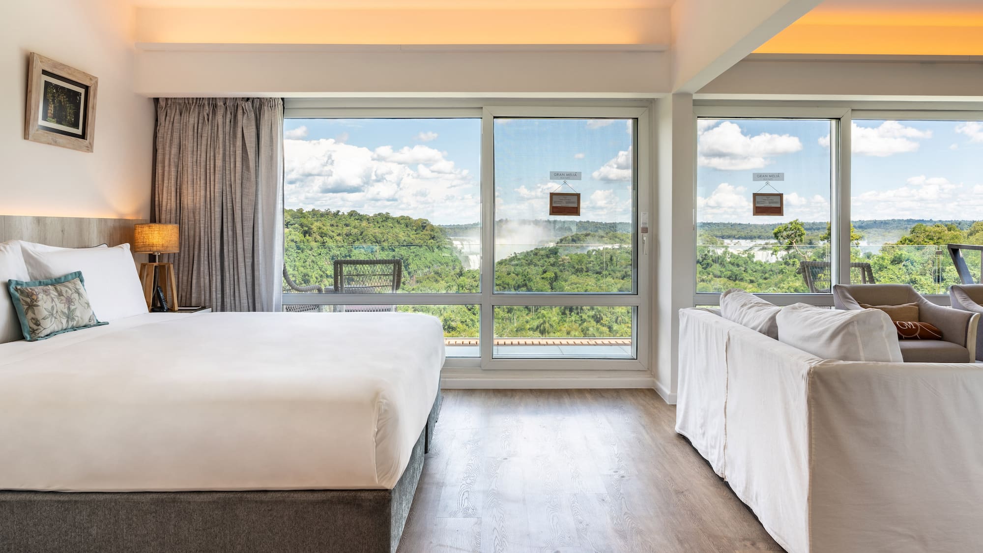 a room with a bed and couches