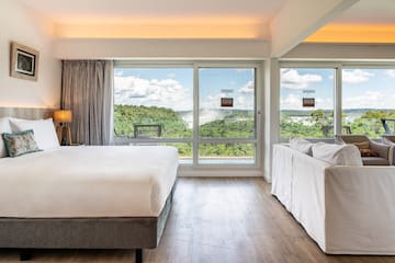 a room with a bed and couches