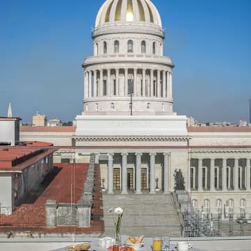 a table with food on it in front of a building