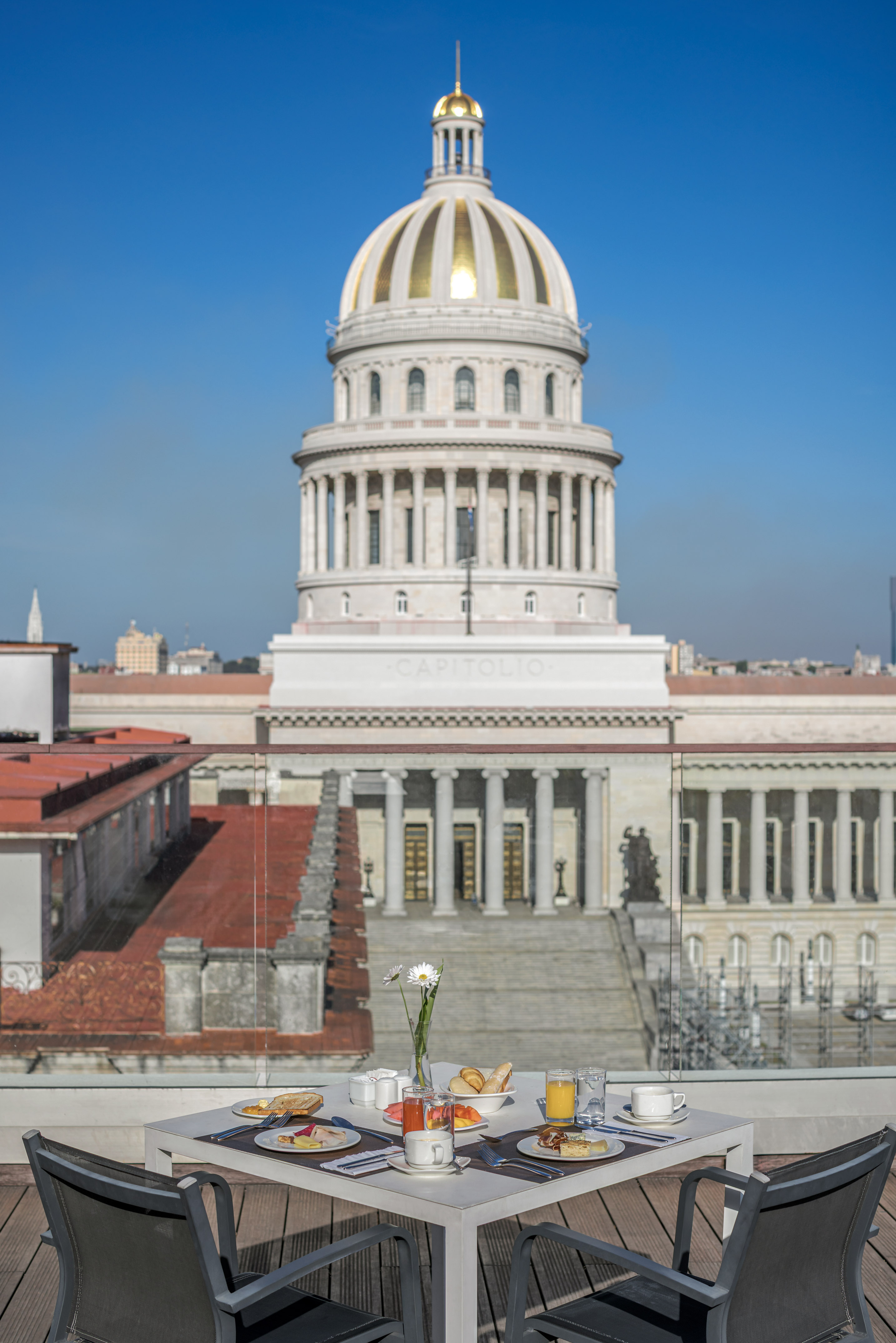 a table with food on it in front of a building