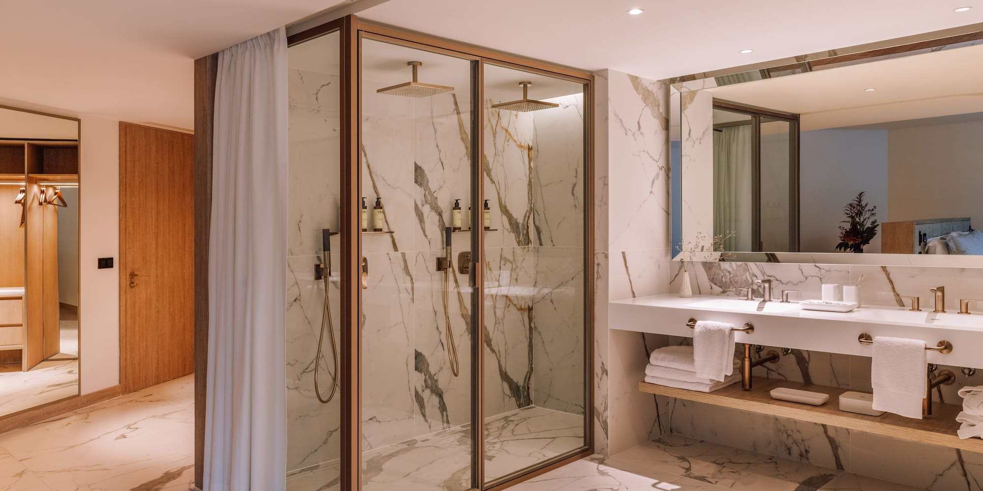 a bathroom with marble walls and shower