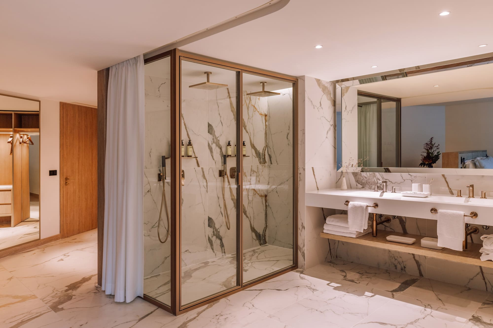 a bathroom with marble walls and shower