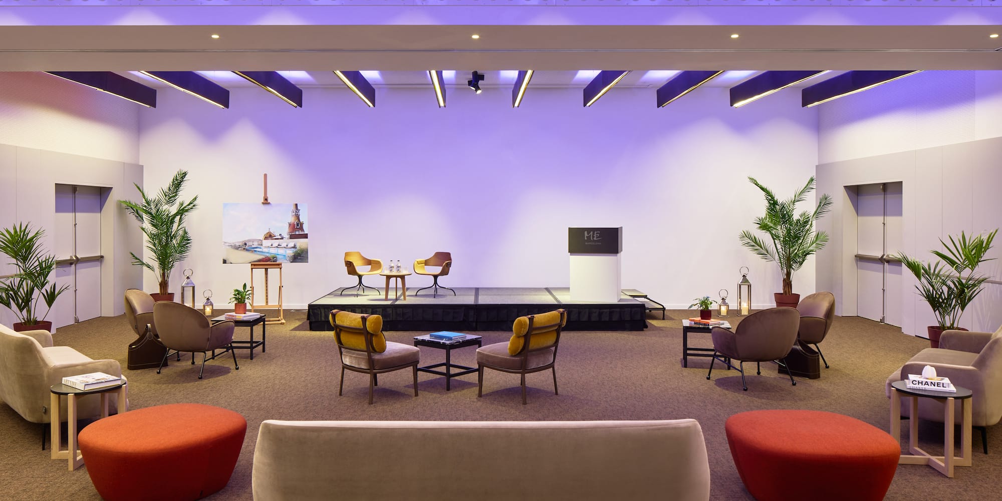 a room with a stage and chairs