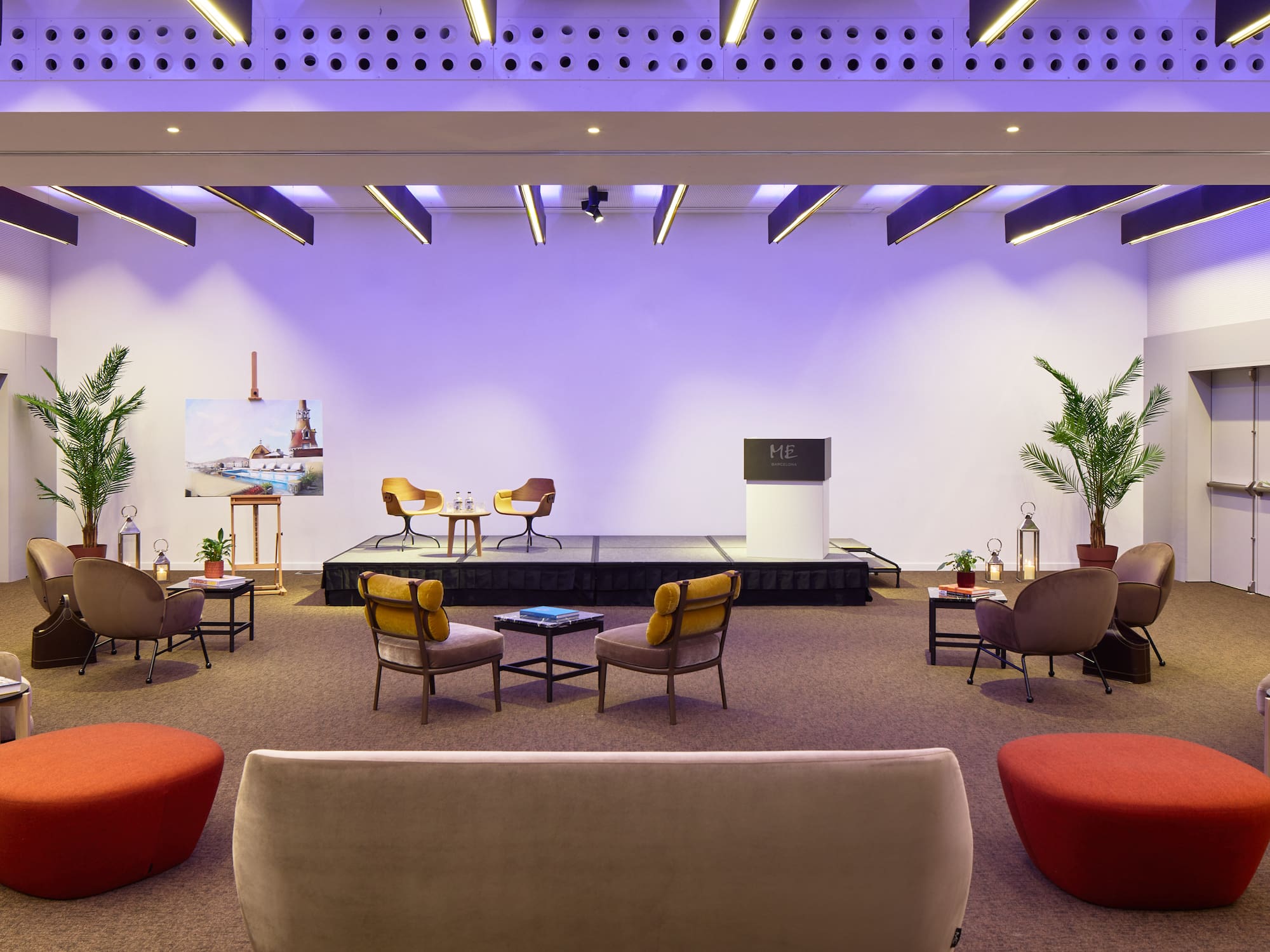 a room with a stage and chairs