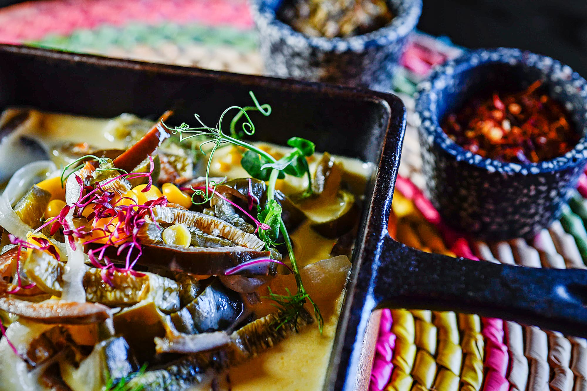 a pan of food with a few bowls of food
