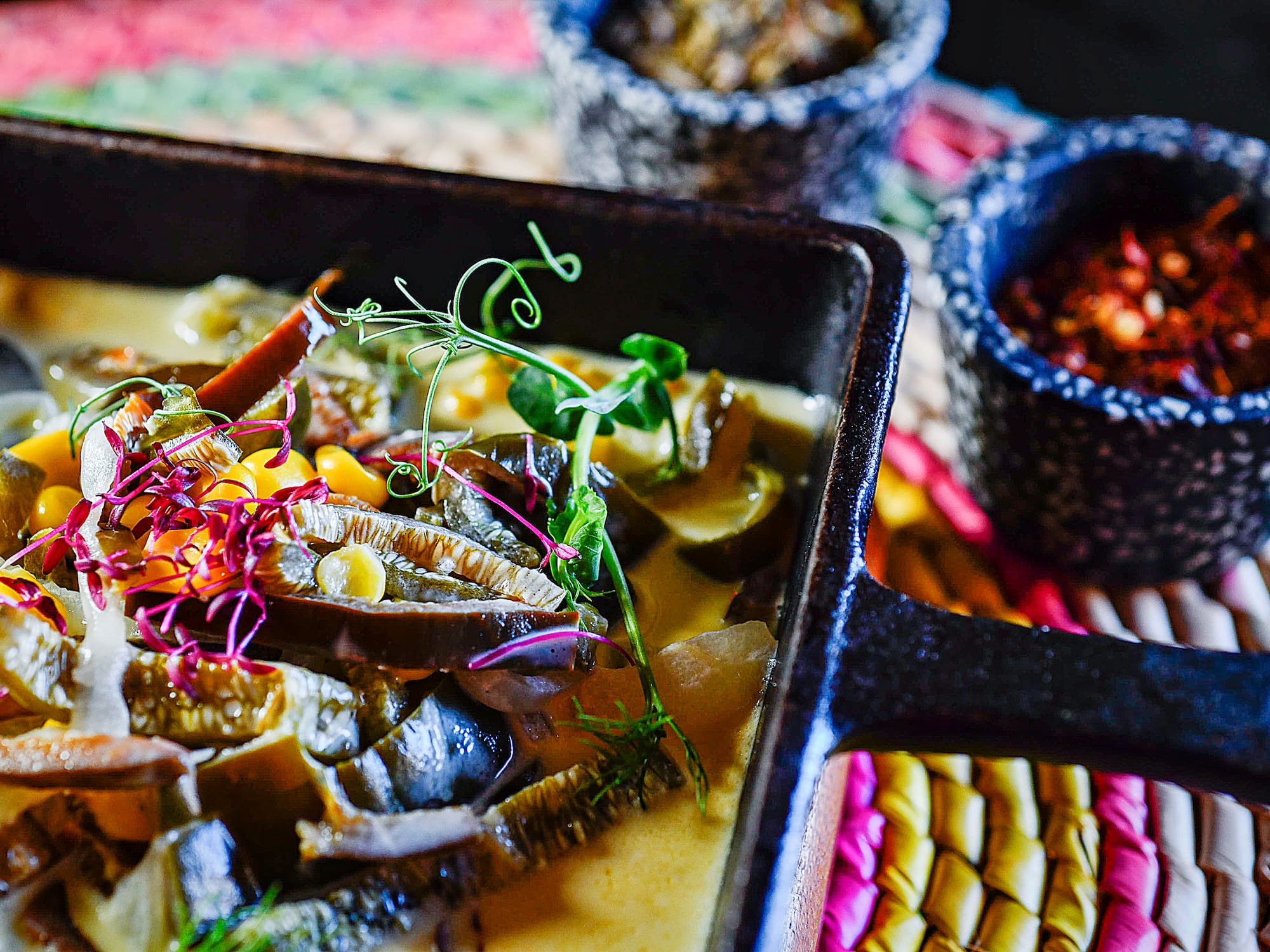 a pan of food with a few bowls of food