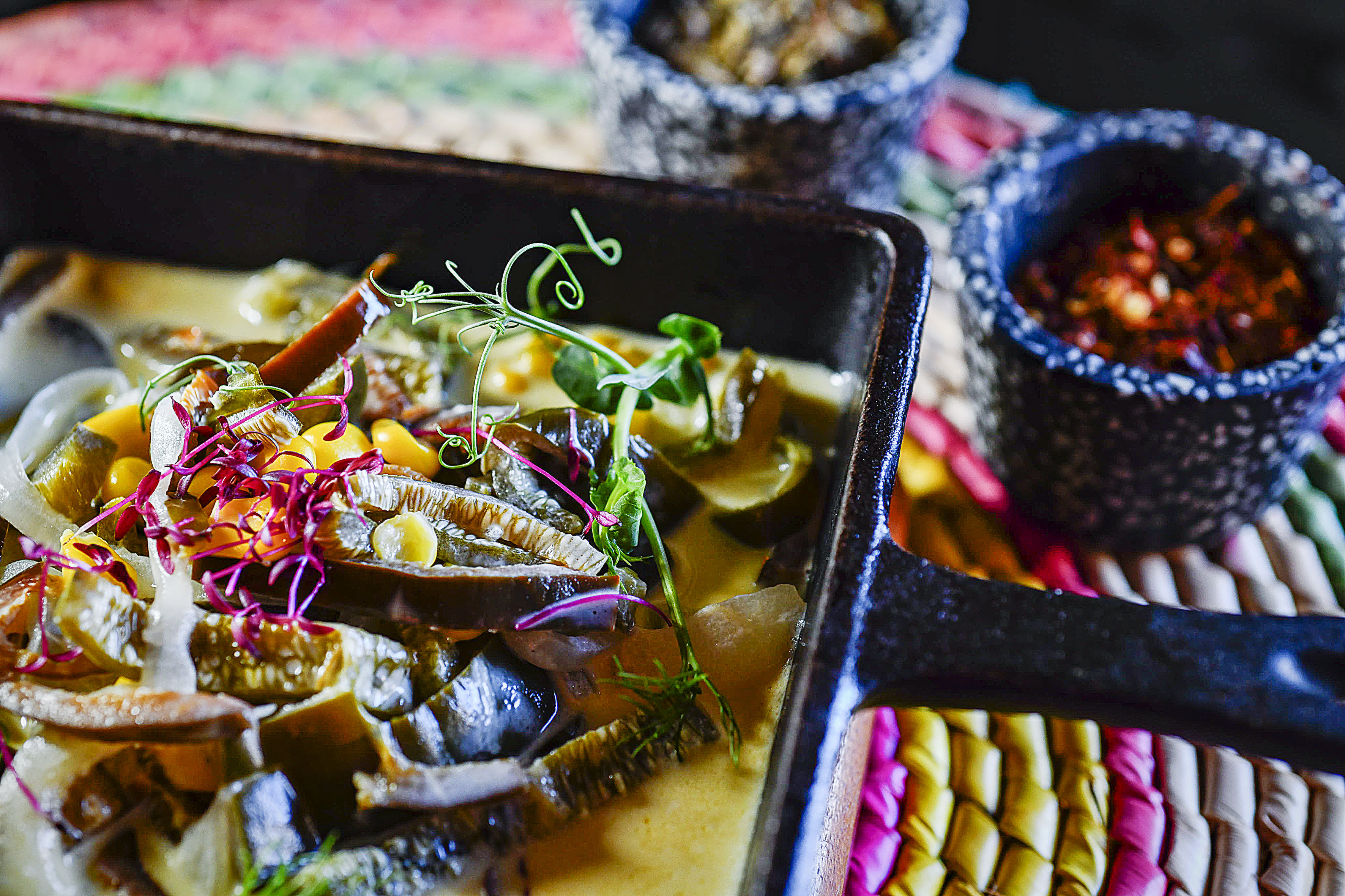 a pan of food with a few bowls of food