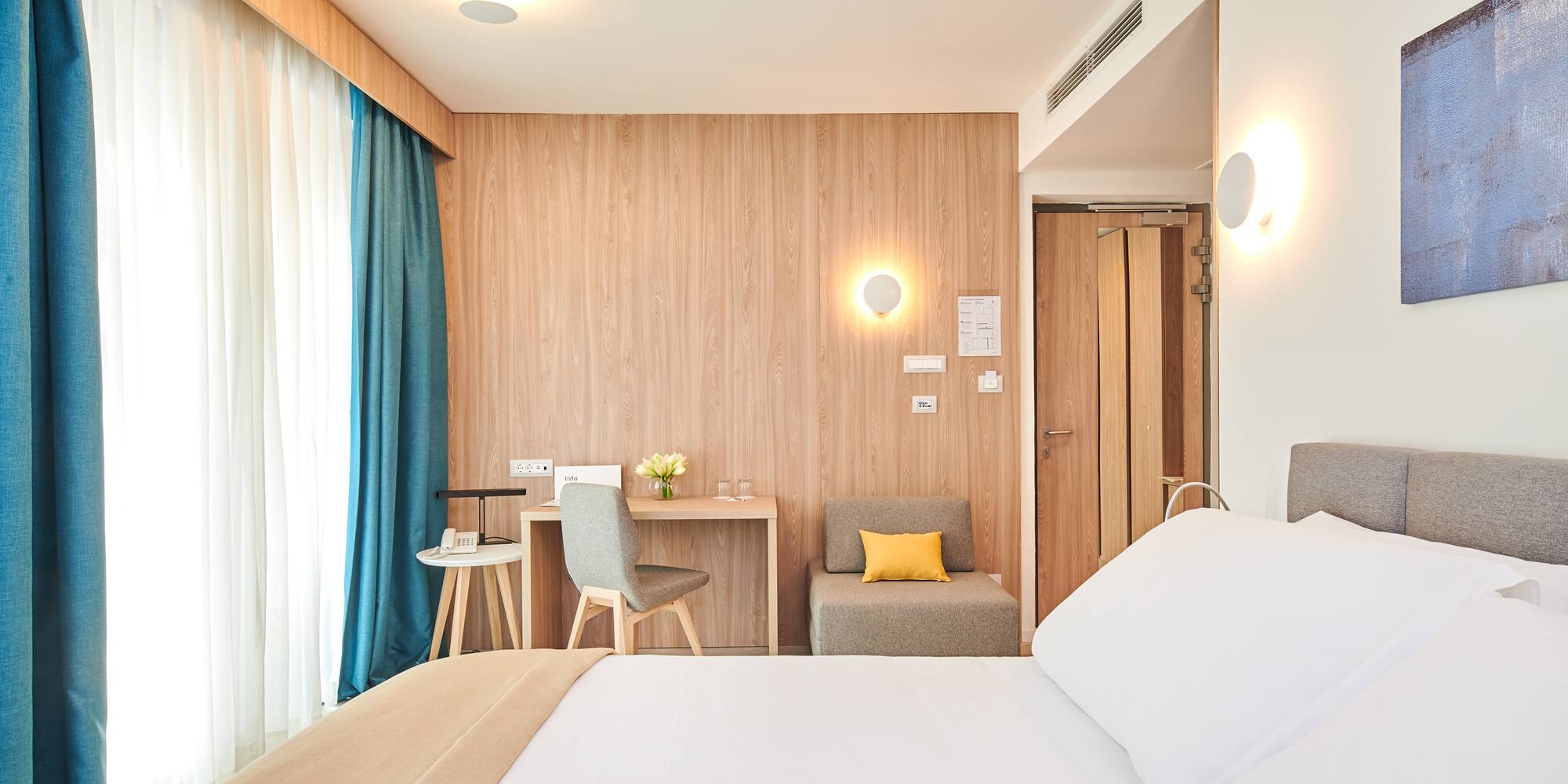 a room with a bed and a desk