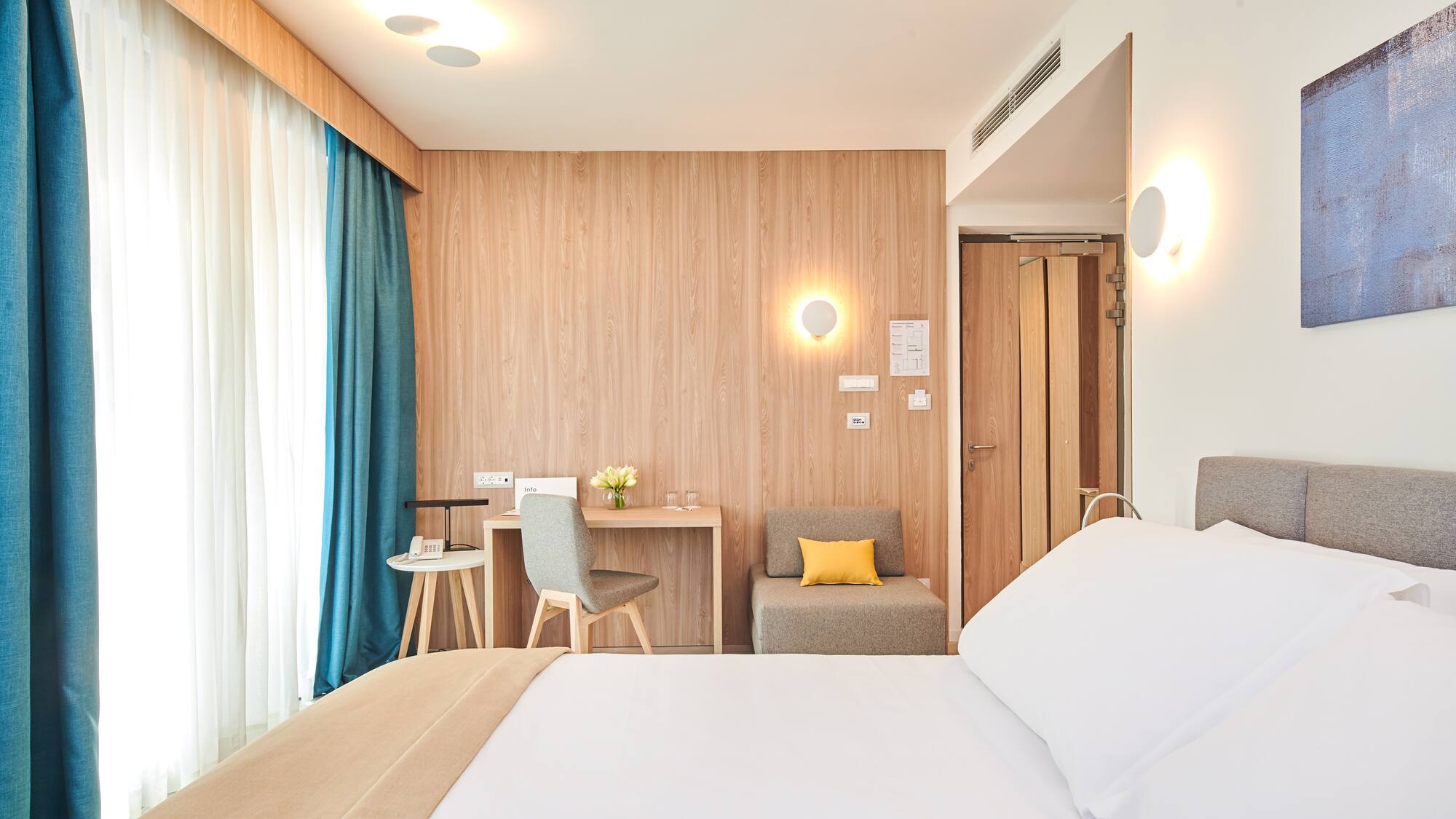 a room with a bed and a desk